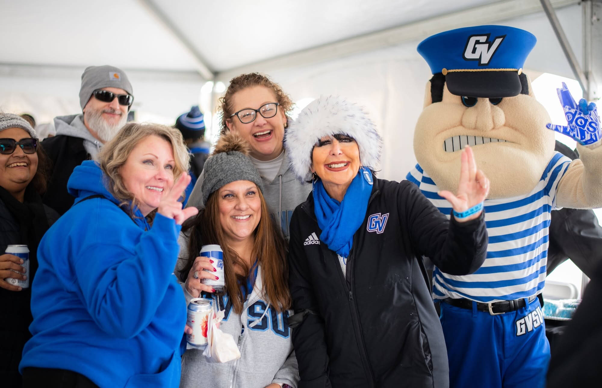 President Mantella anchors up with alumni and Louie at Homecoming